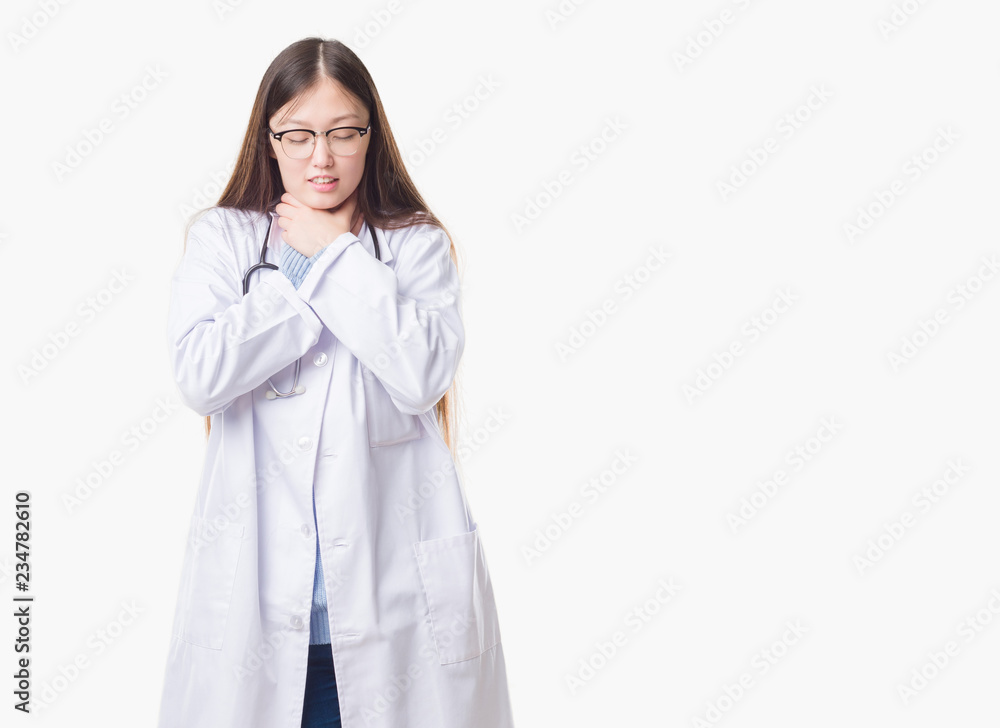 Young Chinese doctor woman over isolated background shouting and suffocate because painful strangle. Health problem. Asphyxiate and suicide concept. Young Chinese doctor woman over isolated background shouting and suffocate because painful strangle. Health problem. Asphyxiate and suicide concept.