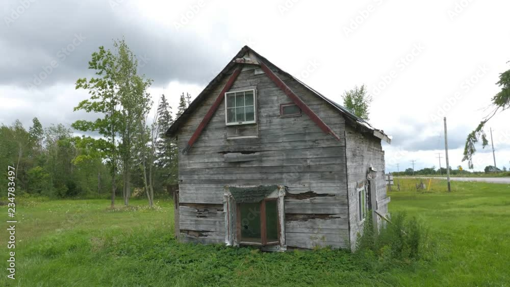 Abandoned and wrecked rural house on side of the road. Ontario, Canada. Handheld shot with stabilized camera and lens. Abandoned and wrecked rural house on side of the road. Ontario, Canada. Handheld shot with stabilized camera and lens.