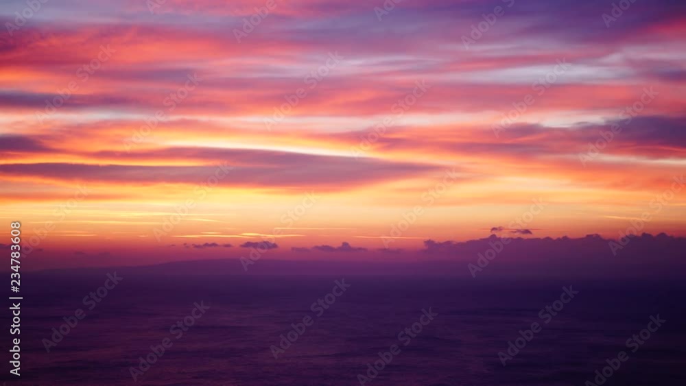 Scenic sunrise over sea surface, red orange burning sky Scenic sunrise over sea surface, red orange burning sky