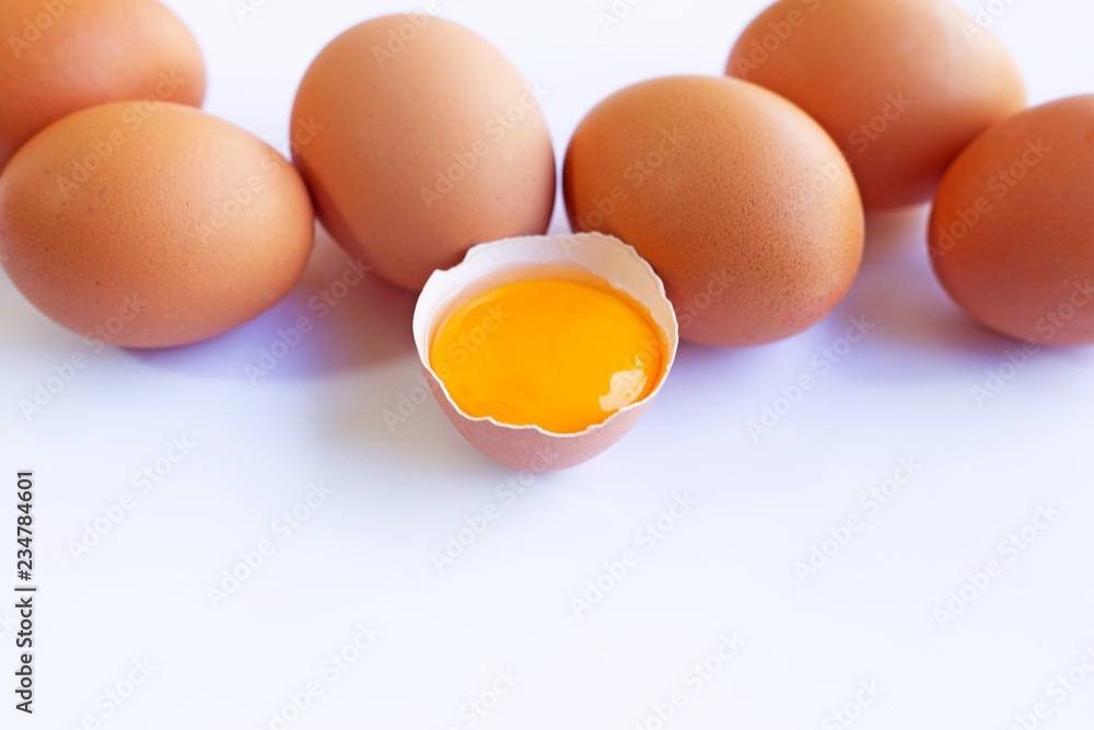 Chicken eggs with yolk on white background. Chicken eggs with yolk on white background.
