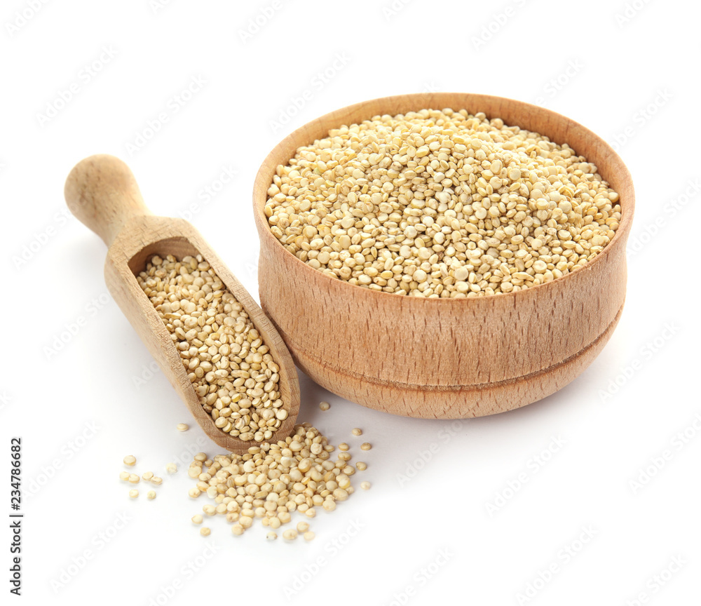 Bowl and scoop with raw quinoa on white background Bowl and scoop with raw quinoa on white background