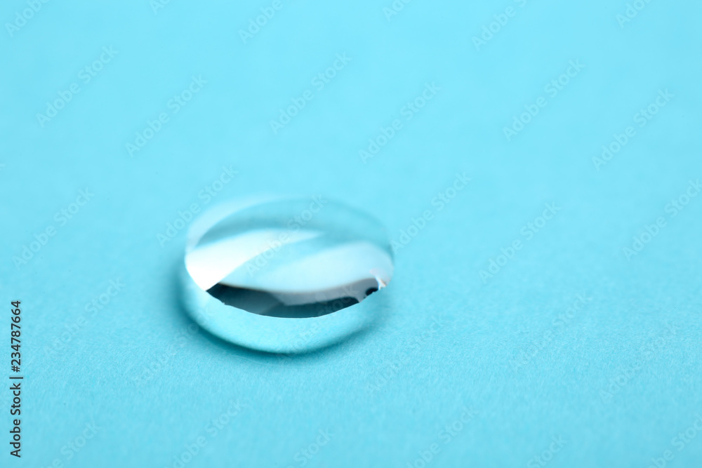 Pure water drop on color background, closeup. Space for text Pure water drop on color background, closeup. Space for text