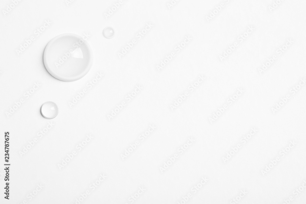Water drops on white background, top view. Space for text