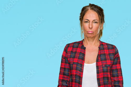 Middle age adult woman wearing casual jacket over isolated background depressed and worry for distress, crying angry and afraid. Sad expression.