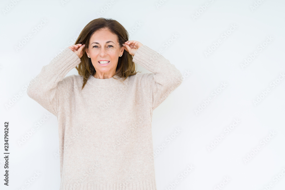 Beautiful middle age woman over isolated background Smiling pulling ears with fingers, funny gesture. Audition problem Beautiful middle age woman over isolated background Smiling pulling ears with fingers, funny gesture. Audition problem