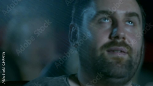 Young man at the movie theatre photo