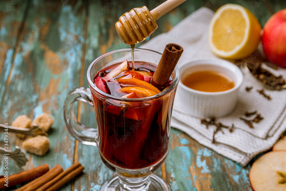 Honey flows into mulled wine Honey flows into mulled wine
