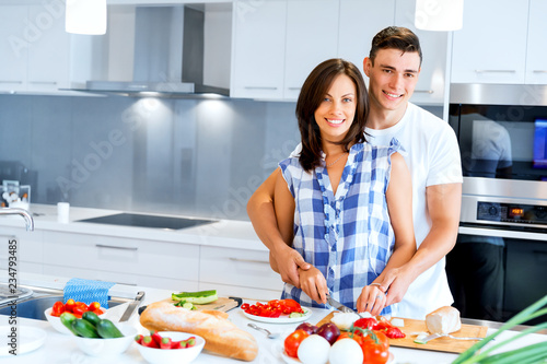 Couple cooking together at home