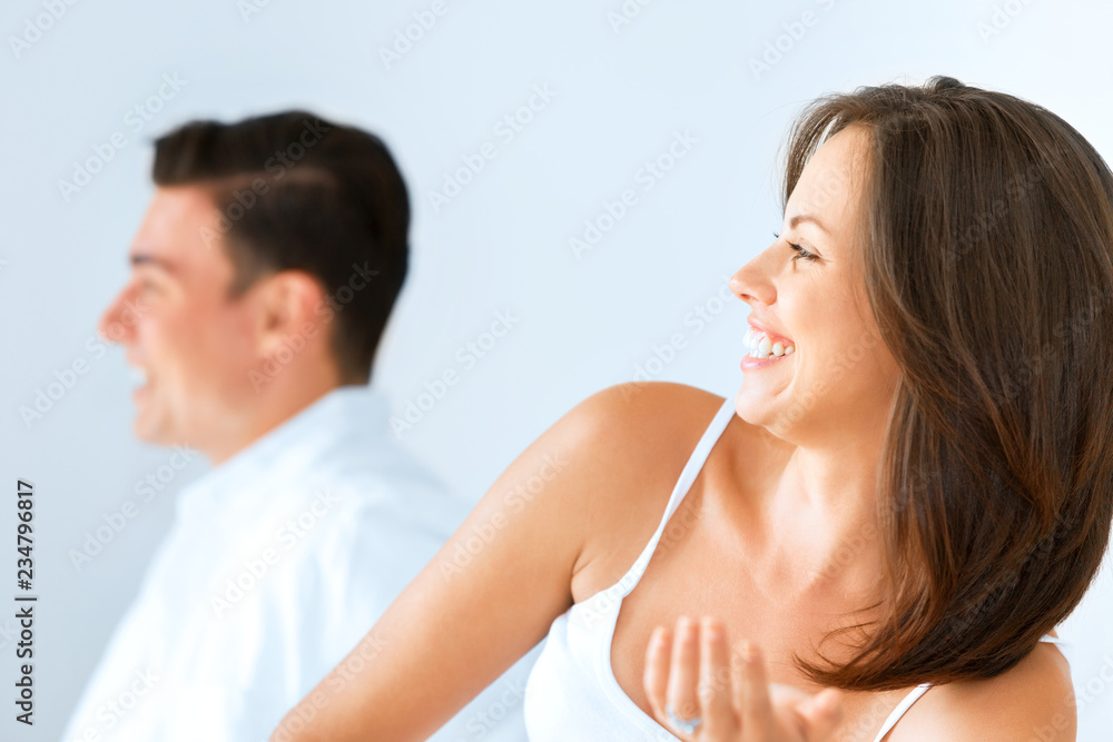 Young happy couple in the bedroom Young happy couple in the bedroom