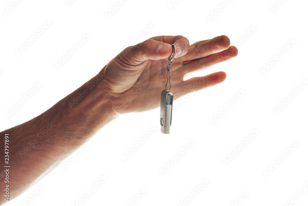 Male hand holding flash drive isolated on white Male hand holding flash drive isolated on white