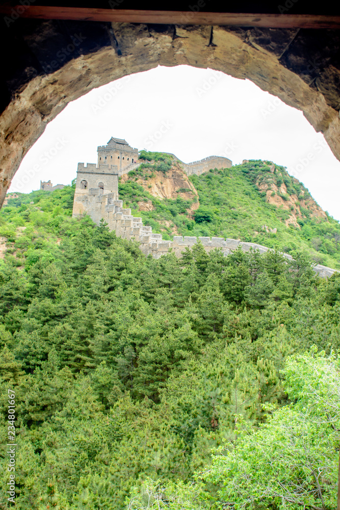 A View of The Great Wall of China Looking Through a Brick Window of a Guard House  in the Jinshanling Mountains