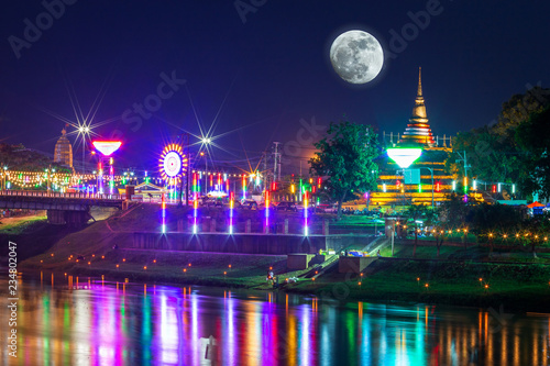 The Loy Krathong festival at Pagoda in the Temple That riverside the Nan River at night is a tourist attraction Phitsanulok, Thailand.