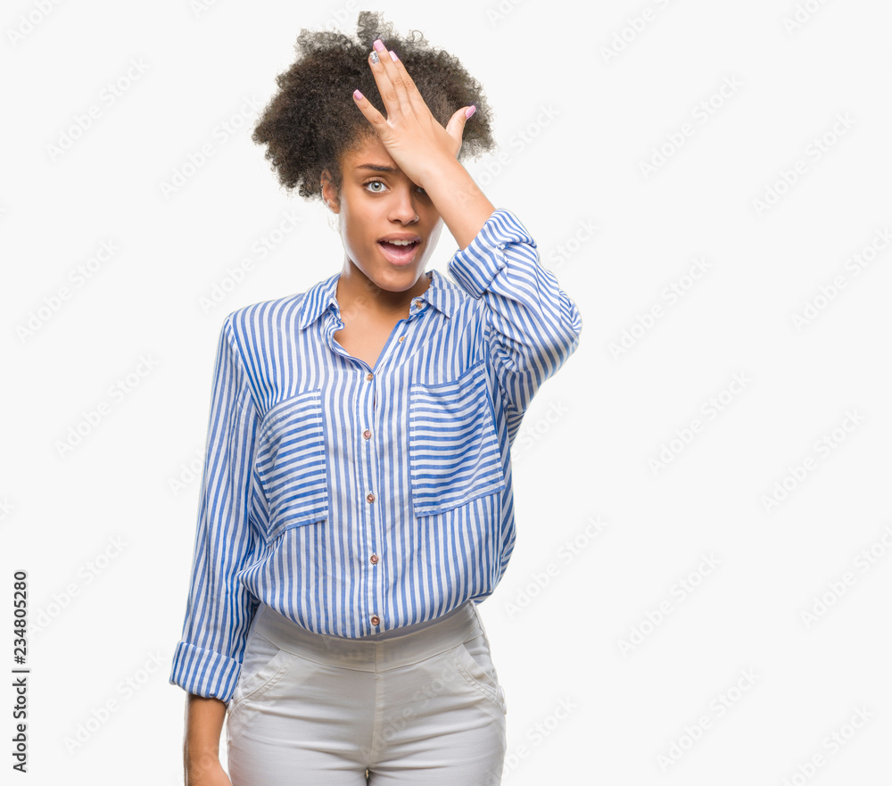 Young afro american woman over isolated background surprised with hand on head for mistake, remember error. Forgot, bad memory concept. Young afro american woman over isolated background surprised with hand on head for mistake, remember error. Forgot, bad memory concept.