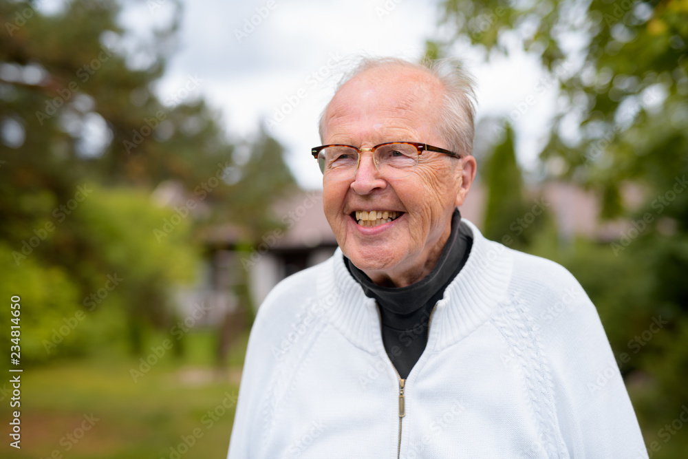Happy Senior Man With Eyeglasses Smiling And Thinking At Home Outdoors Happy Senior Man With Eyeglasses Smiling And Thinking At Home Outdoors