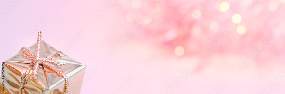 Merry Christmas, New Year, gifts in gold boxes, red Christmas balls are piled in the left corner. The background is pink. Merry Christmas, New Year, gifts in gold boxes, red Christmas balls are piled in the left corner. The background is pink.