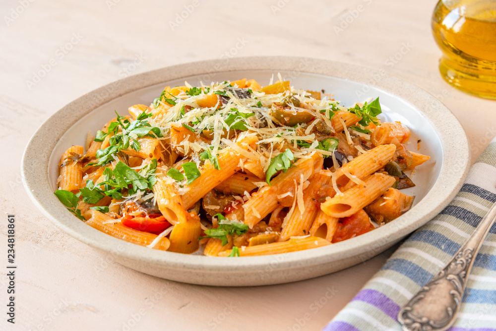 Pasta caponata on a plate close up Pasta caponata on a plate close up