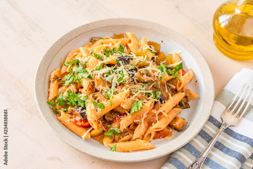 Pasta caponata on a plate close up Pasta caponata on a plate close up
