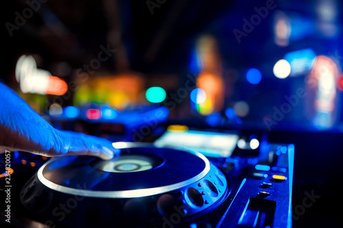 DJ sound equipment at nightclubs and music festivals, EDM, future house music and so on. Parties concept, sound technique. DJ playing on the best