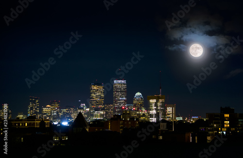 Boston skyline at night with full moon