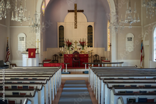Fototapeta Light shining on decorated church altar