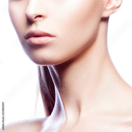 Part of girl face with natural nude make-up and clean skin over white backgroun. Beautiful Young Woman with Clean Fresh Skin close up. Skincare female health concept 