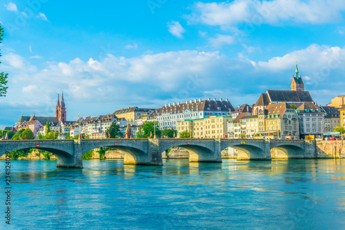 Basler münster and Saint martin church viewed behind the mittlere brücke in Basel, Switzerland photo