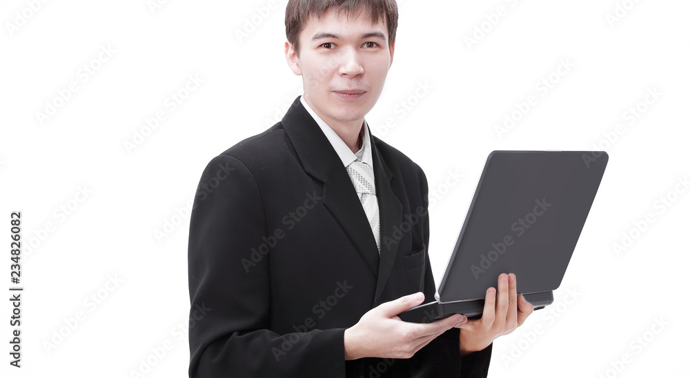 successful young businessman holding a laptop open successful young businessman holding a laptop open