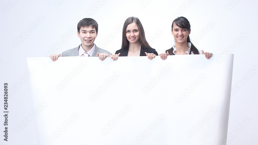 successful business team holding a blank banner. successful business team holding a blank banner.