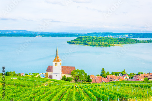 Church at Ligerz standing in the middle of vineyards of Bielersee, Switzerland photo