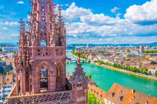 Riverside of Rhine in Basel dominated by majestic building of Munster church, Switzerland