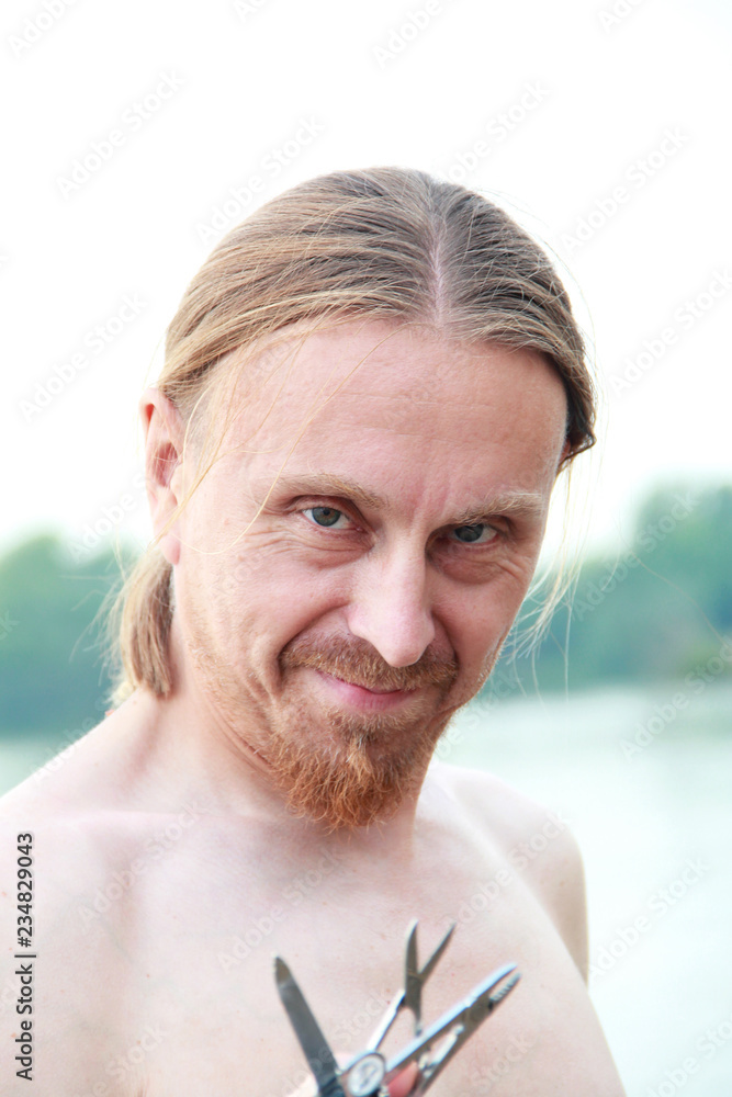 Russian man with red beard, cunning, close-up portrait Russian man with red beard, cunning, close-up portrait