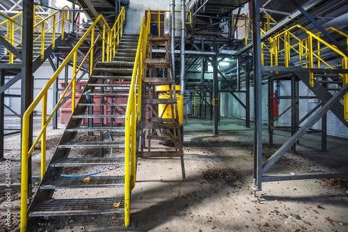 metal truss structures on modern waste recycling processing plant. Separate garbage collection. Recycling and storage of waste for further disposal. © hiv360