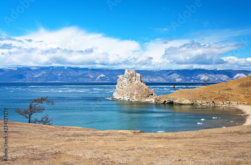 Lake Baikal in the spring. Olkhon Island and the famous Shamanka Rock on May sunny day