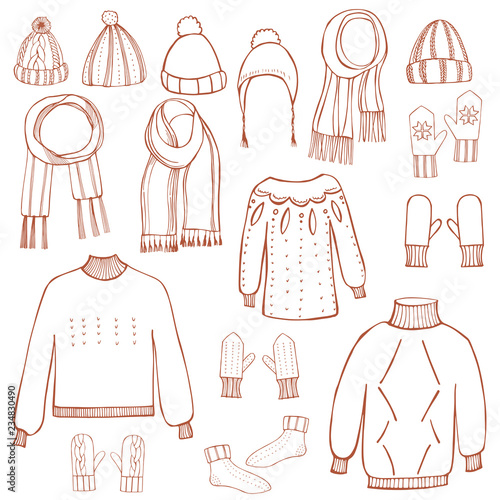 Hand drawn winter knitted clothes set .  Vector sketch  illustration.