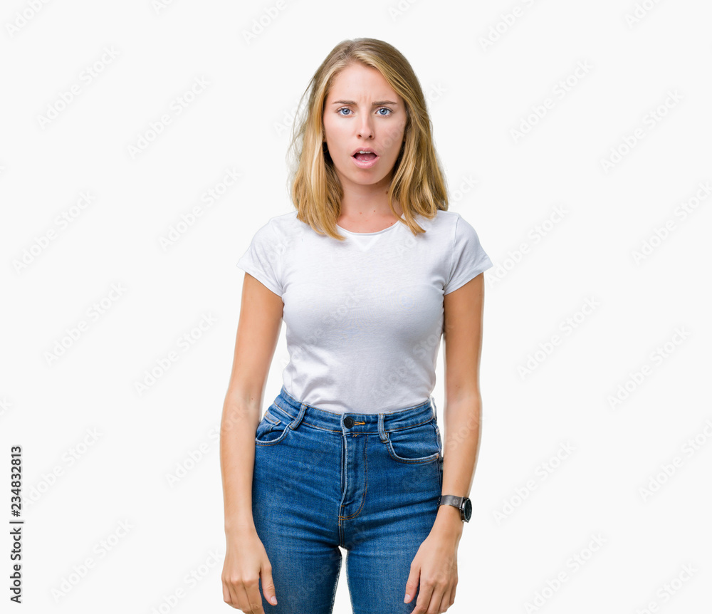 Beautiful young woman wearing casual white t-shirt over isolated background In shock face, looking skeptical and sarcastic, surprised with open mouth Beautiful young woman wearing casual white t-shirt over isolated background In shock face, looking skeptical and sarcastic, surprised with open mouth