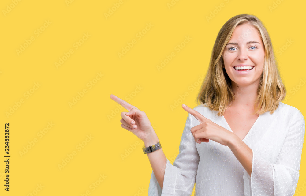 Beautiful young elegant woman over isolated background smiling and looking at the camera pointing with two hands and fingers to the side. Beautiful young elegant woman over isolated background smiling and looking at the camera pointing with two hands and fingers to the side.