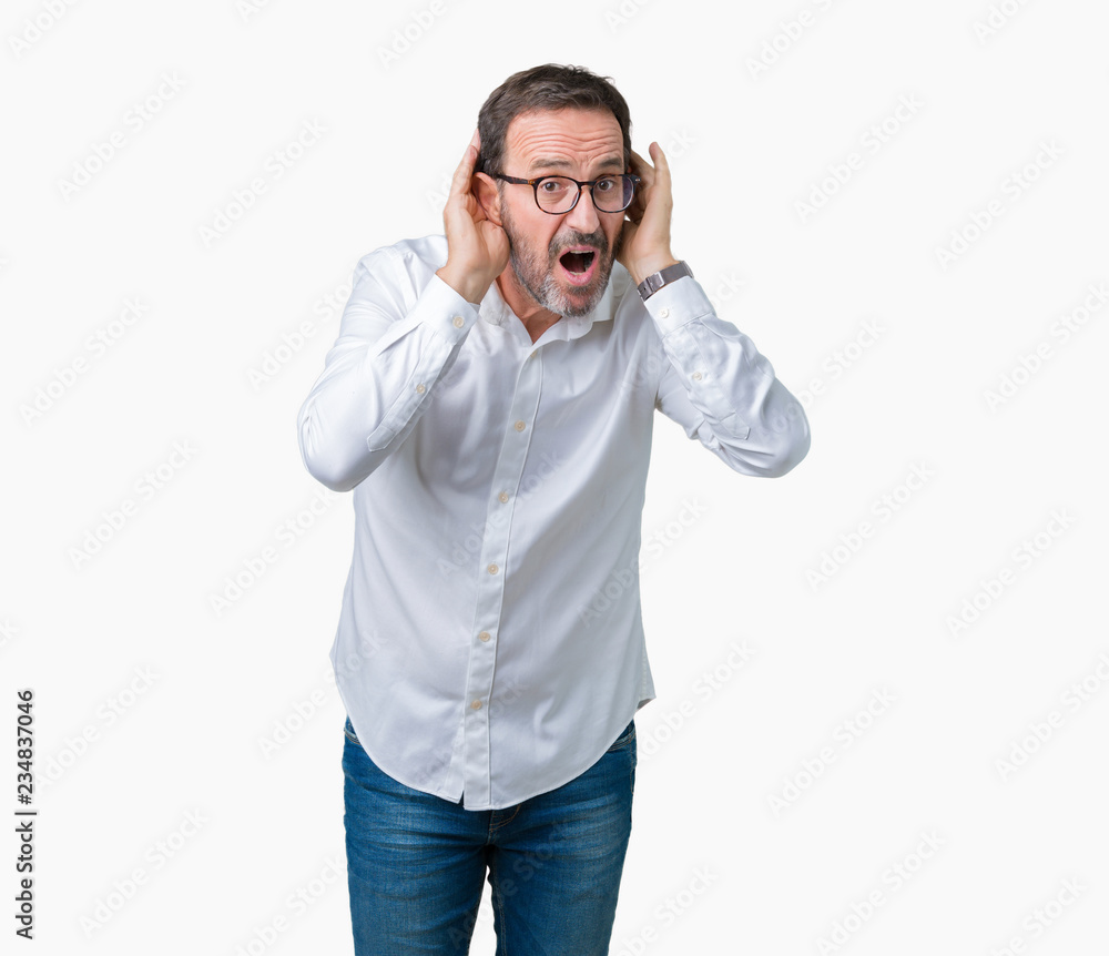 Handsome middle age elegant senior business man wearing glasses over isolated background Trying to hear both hands on ear gesture, curious for gossip. Hearing problem, deaf Handsome middle age elegant senior business man wearing glasses over isolated background Trying to hear both hands on ear gesture, curious for gossip. Hearing problem, deaf