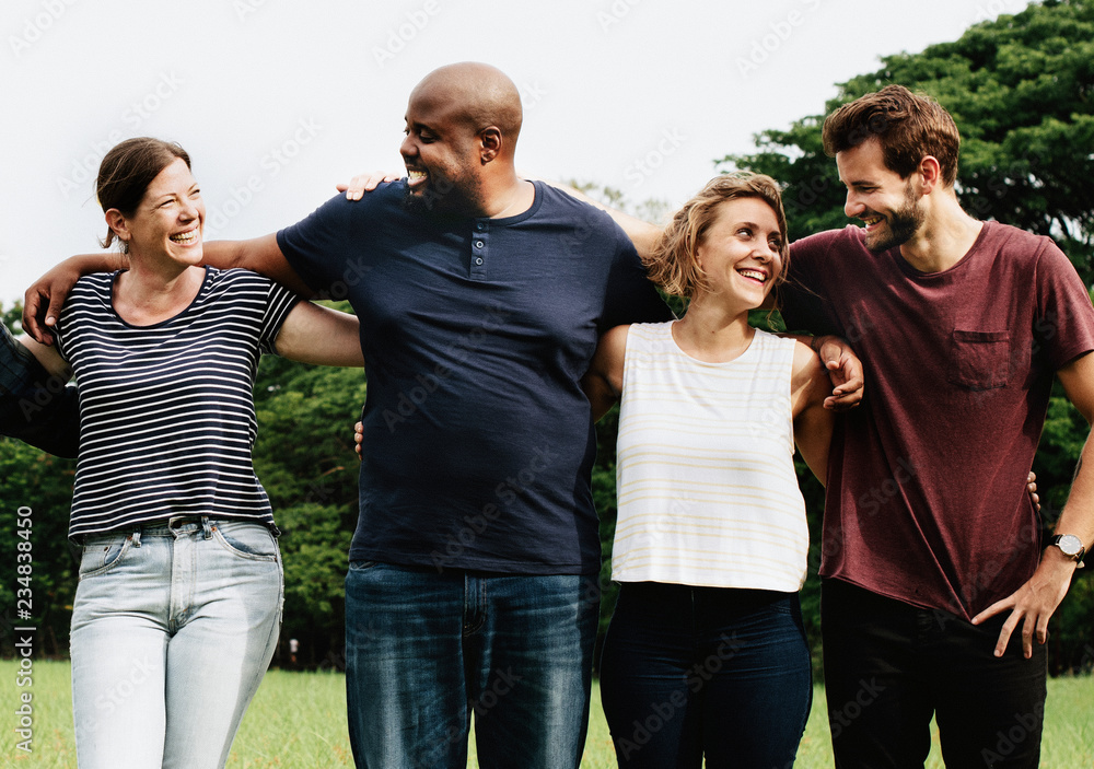 Group of people hugging each other in the park Group of people hugging each other in the park