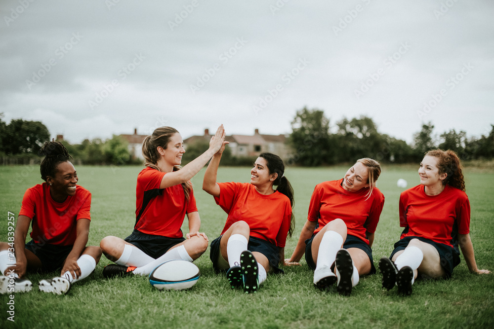 Fototapeta premium Cheerful rugby players doing a high five