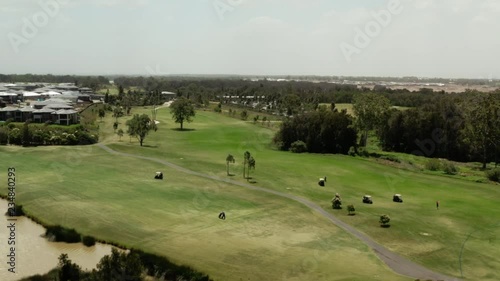 Golfers Driving around the course in Golf Carts