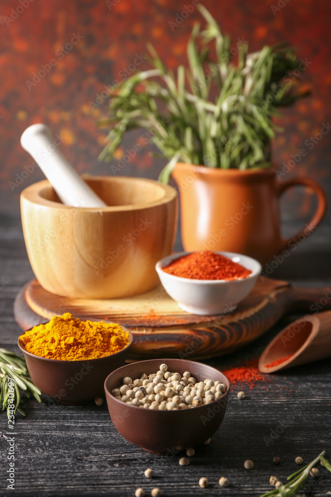 © Pixel-Shot - Bowls with different aromatic spices on wooden table