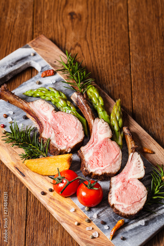 Obraz na płótnie Baked lamb loin, served with asparagus.