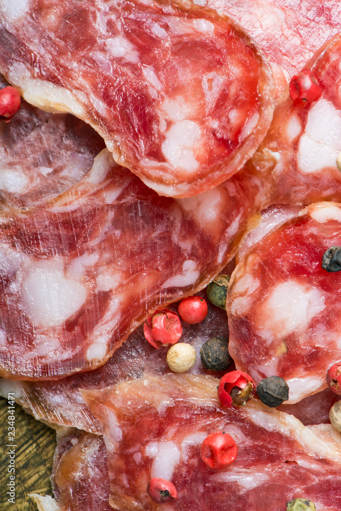 sliced italian salami with red and black pepper sliced italian salami with red and black pepper