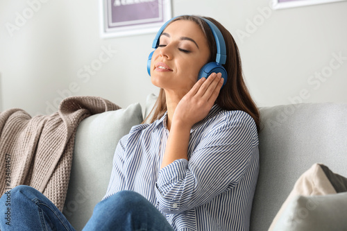 Beautiful woman listening t...