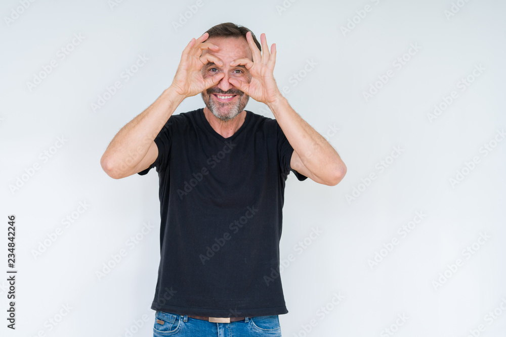Senior man over isolated background Trying to open eyes with fingers, sleepy and tired for morning fatigue Senior man over isolated background Trying to open eyes with fingers, sleepy and tired for morning fatigue