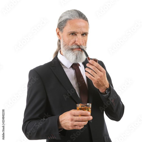 Elderly businessman with gl...