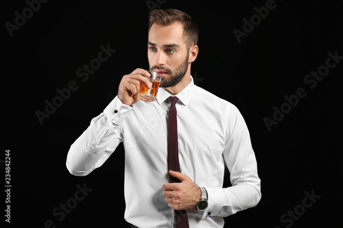 Businessman with glass of w...