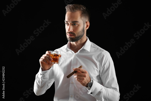 Businessman with glass of w...