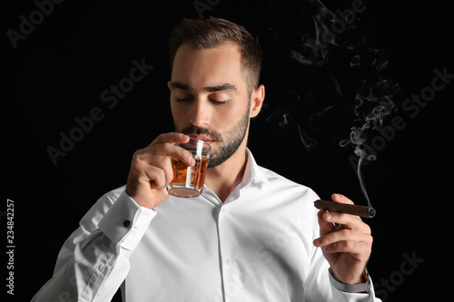 Businessman with glass of w...