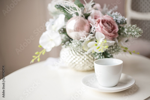 white cup on a decorated coffee table